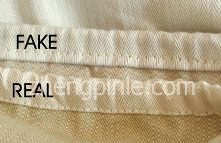真假Hermes腰带防尘袋的收口走线位置对比